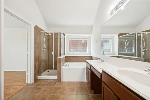 a bathroom with a sink a bathtub and a shower