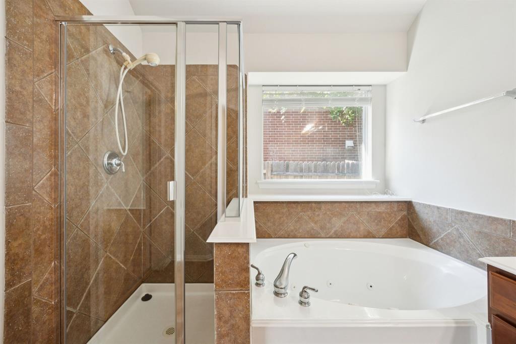 3501 Gravel Circle North Grapevine, TX 76092 - Photo 23 of 36 a bathroom with a tub and a shower