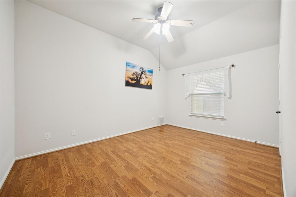 3501 Gravel Circle North Grapevine, TX 76092 - Photo 26 of 36 an empty room with windows and fan