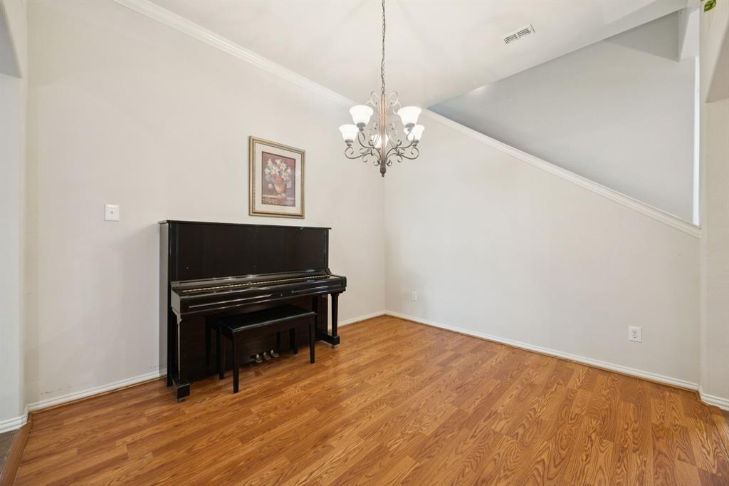 3501 Gravel Circle North Grapevine, TX 76092 - Photo 4 of 36 a view of a livingroom with a piano and wooden floor
