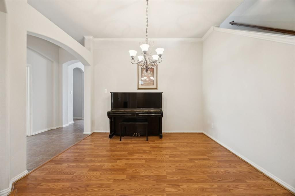 3501 Gravel Circle North Grapevine, TX 76092 - Photo 5 of 36 a living room with furniture and a chandelier