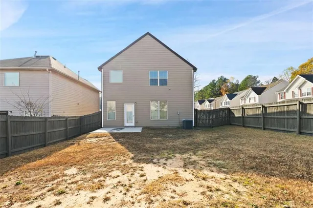 a view of a backyard of the house