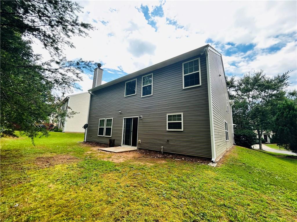 2920 Centerglen Lane Cumming, GA 30040 - Photo 14 of 14 a view of a house with backyard and trees