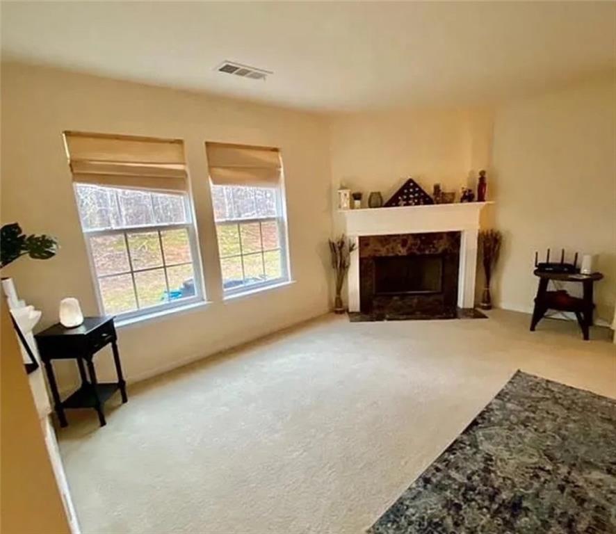 2920 Centerglen Lane Cumming, GA 30040 - Photo 3 of 14 a view of a livingroom with furniture and a fireplace