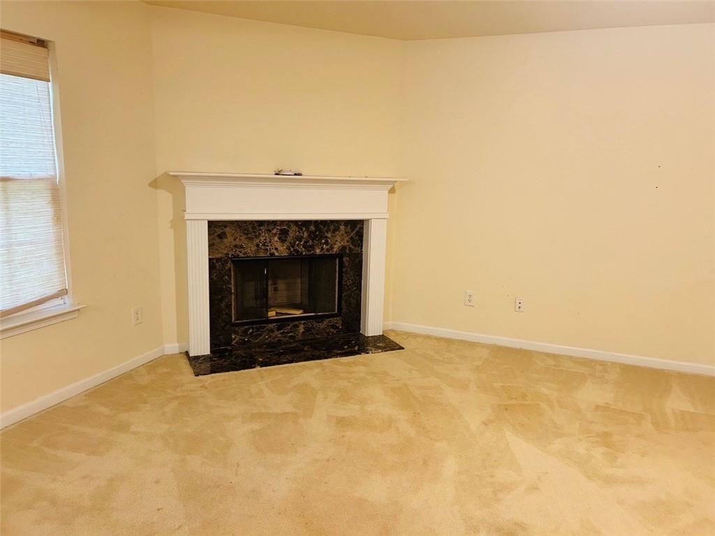2920 Centerglen Lane Cumming, GA 30040 - Photo 5 of 14 a living room with a fireplace