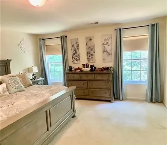 a bed room with a bed and a dresser
