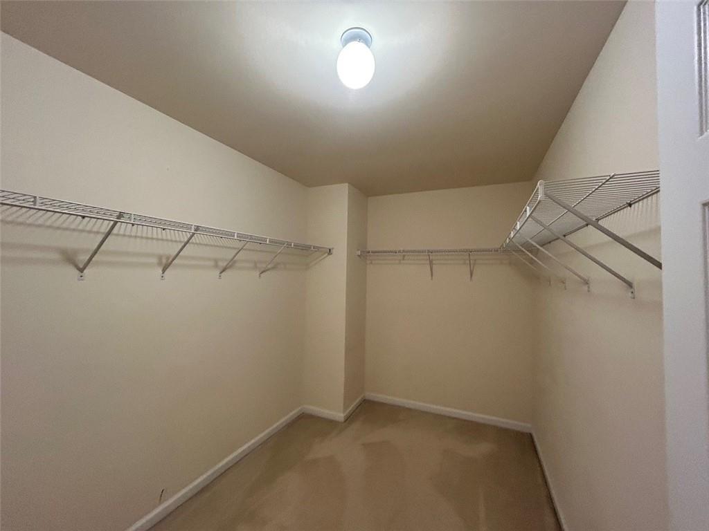 2920 Centerglen Lane Cumming, GA 30040 - Photo 10 of 14 a view of a room with racks on the wall