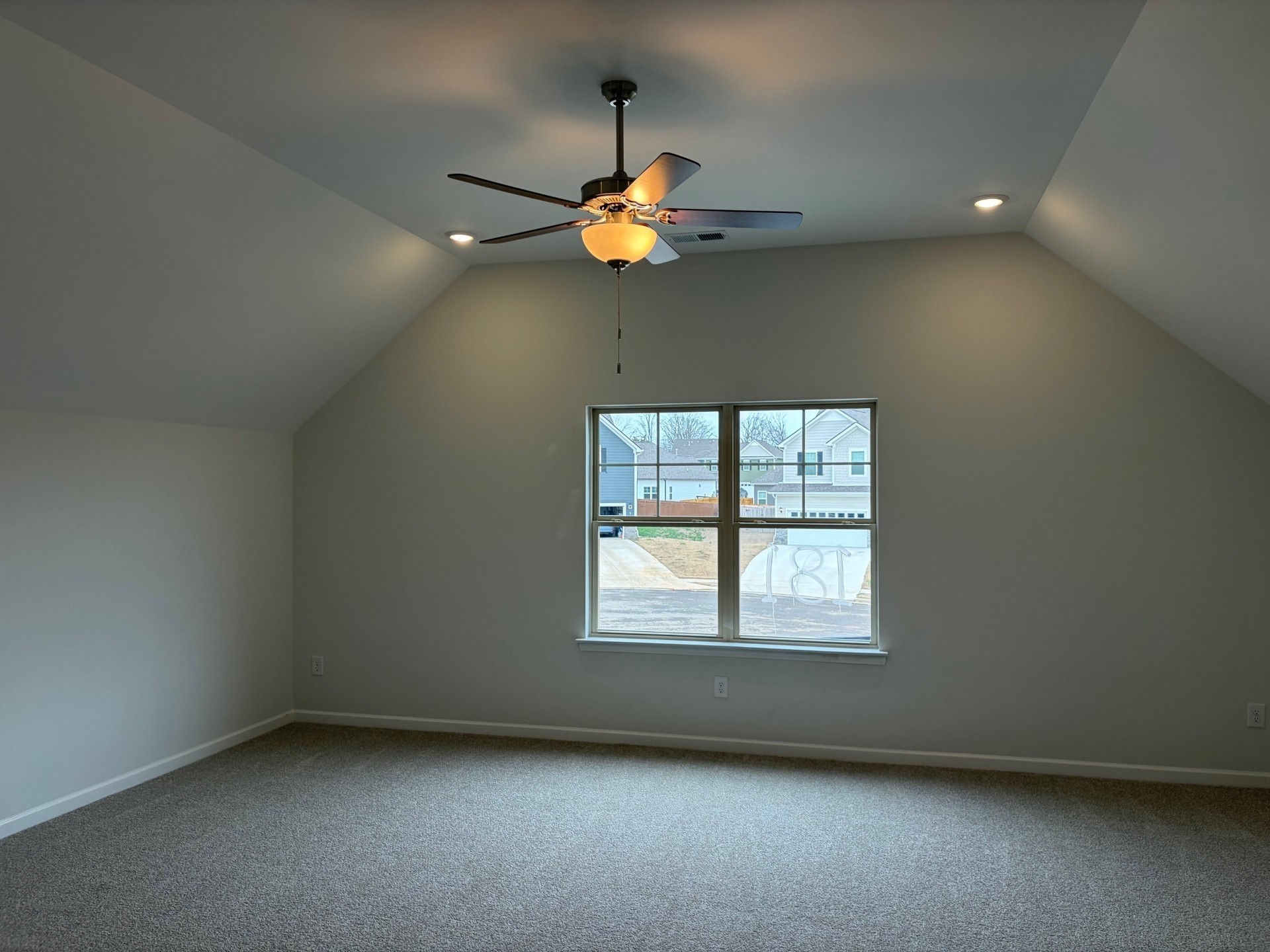 7006 Sully Court Fairview, TN 37062 - Photo 6 of 9 an empty room with a window and ceiling fan
