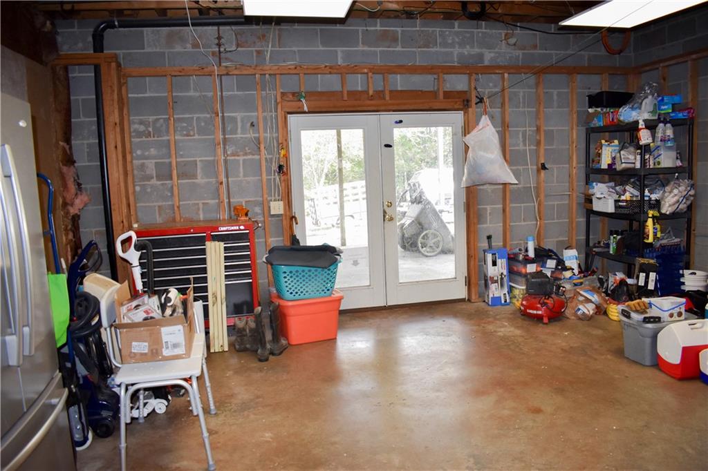 6882 Cowan Mill Road Winston, GA 30187 - Photo 30 of 50 a room with wooden furniture and windows