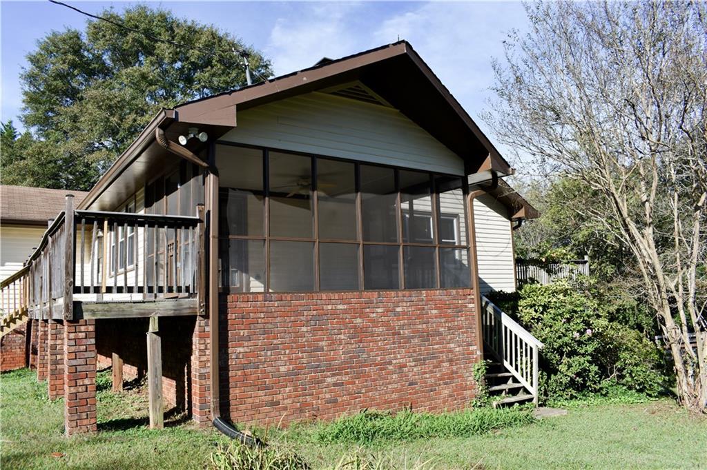 6882 Cowan Mill Road Winston, GA 30187 - Photo 3 of 50 a front view of a house with a yard