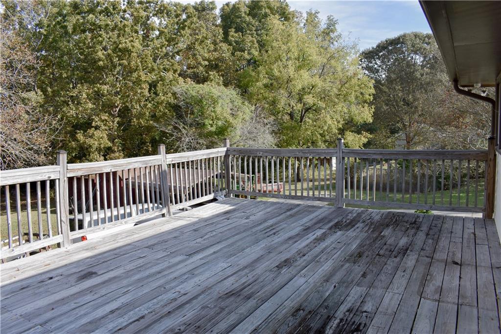 6882 Cowan Mill Road Winston, GA 30187 - Photo 43 of 50 a view of deck with wooden floor and fence