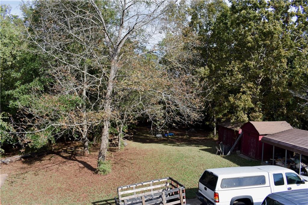 6882 Cowan Mill Road Winston, GA 30187 - Photo 47 of 50 a view of a house with a yard