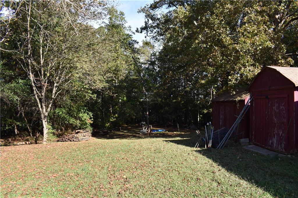 6882 Cowan Mill Road Winston, GA 30187 - Photo 6 of 50 a view of swimming pool with an outdoor space