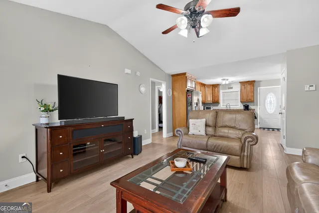 a kitchen with granite countertop stainless steel appliances and wooden cabinets