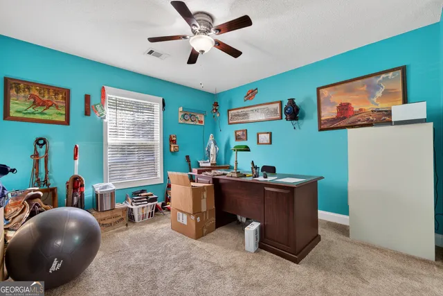 a bedroom with a bed dresser and a window