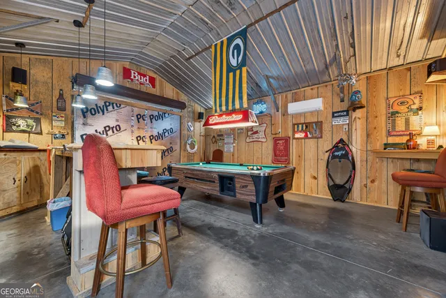 a table tennis table and chairs in a room