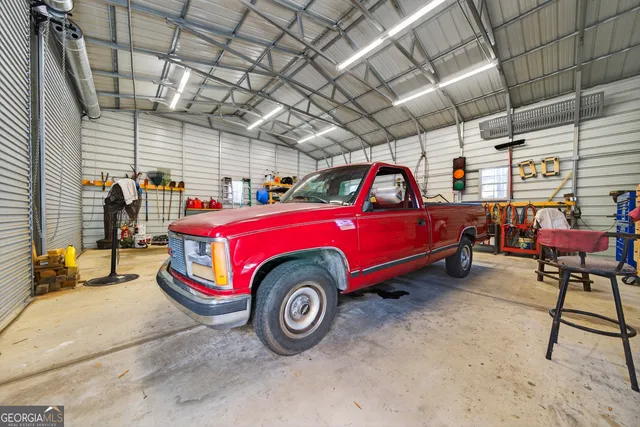 swimming pool view with a seating space