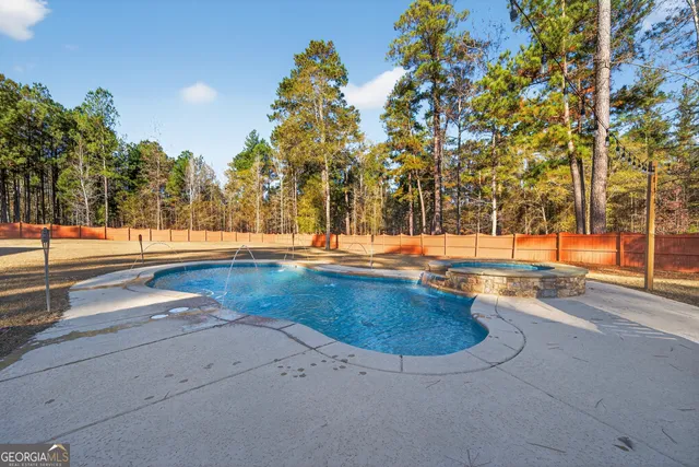 a living room with furniture a flat screen tv and wooden floor