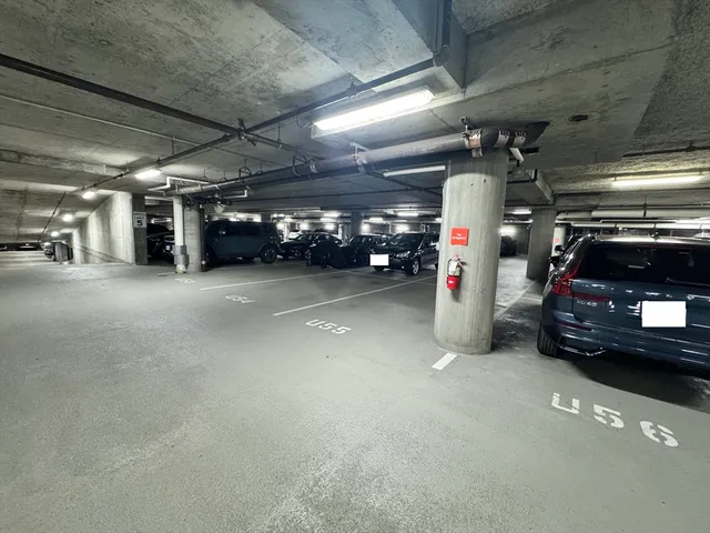 a view of parking garage with cars