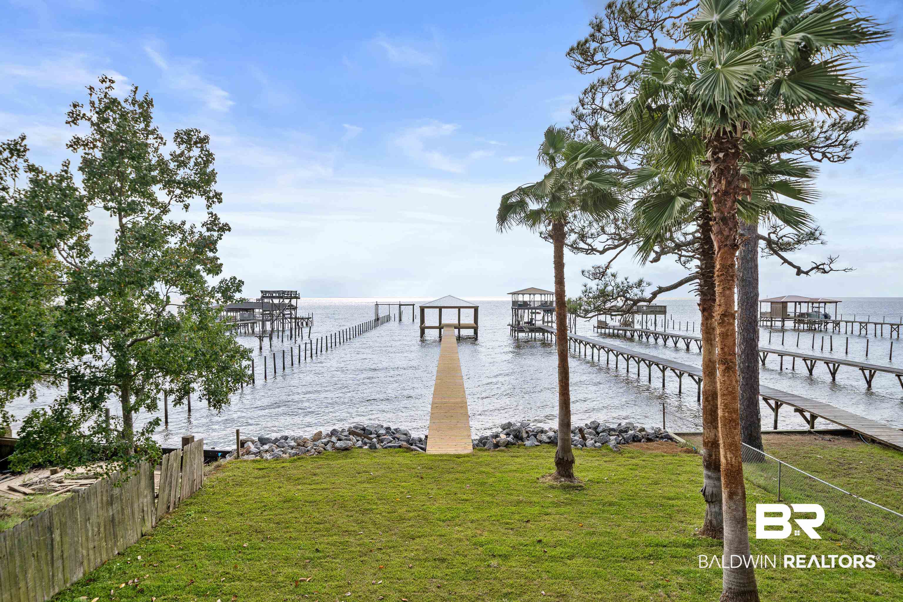12453 County Road 1 Fairhope, AL 36532 - Photo 2 of 33 Dock area featuring a water view and a lawn