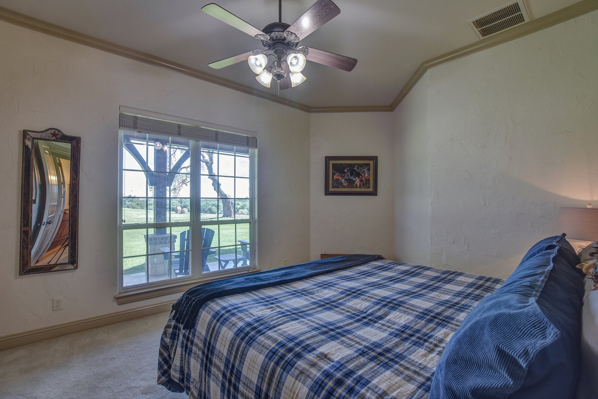 18601 County Road 214 Brookesmith, TX 76827 - Photo 17 of 39 Main House: Guest Bedroom featuring crown molding, carpet flooring, and ceiling fan