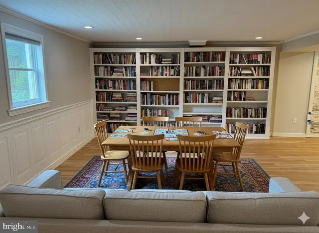 a view of wooden floor and windows in a room