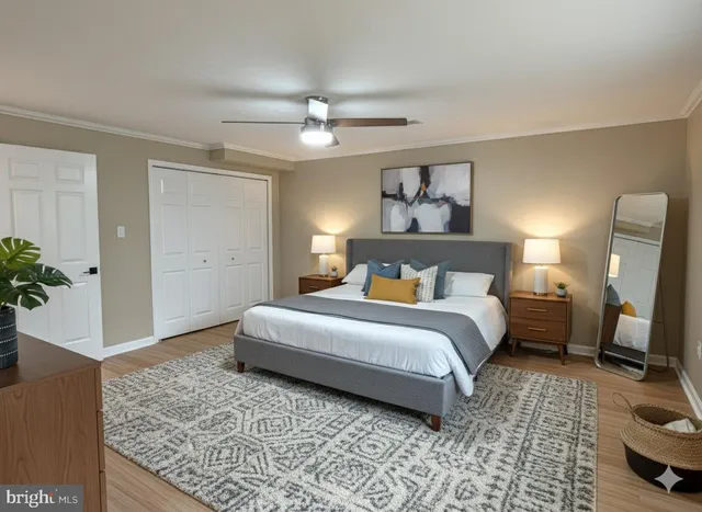 a view of empty room with wooden floor and window