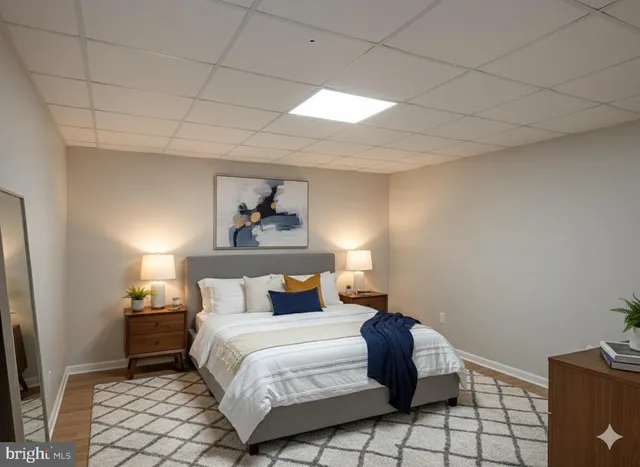 a bathroom with a granite countertop toilet sink and mirror