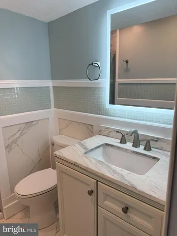 a bathroom with a shower and a toilet