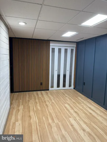 a bedroom with a bed and a closet