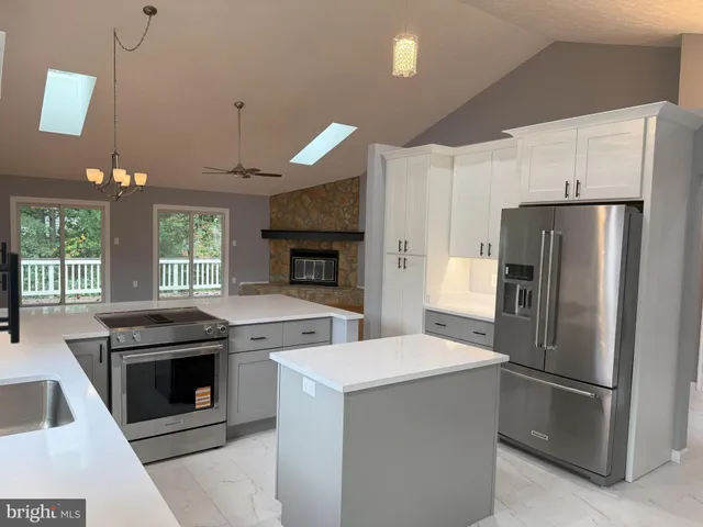 a kitchen with a stove oven and refrigerator