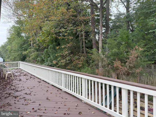 a view of balcony with wooden floor