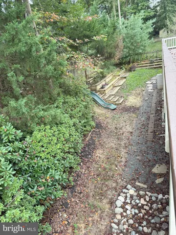 a front view of house with a garden