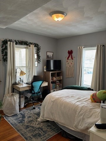 50 Derby Street, Unit 2 Somerville, MA 02145 - Photo 8 of 18 a bedroom with a bed and a window
