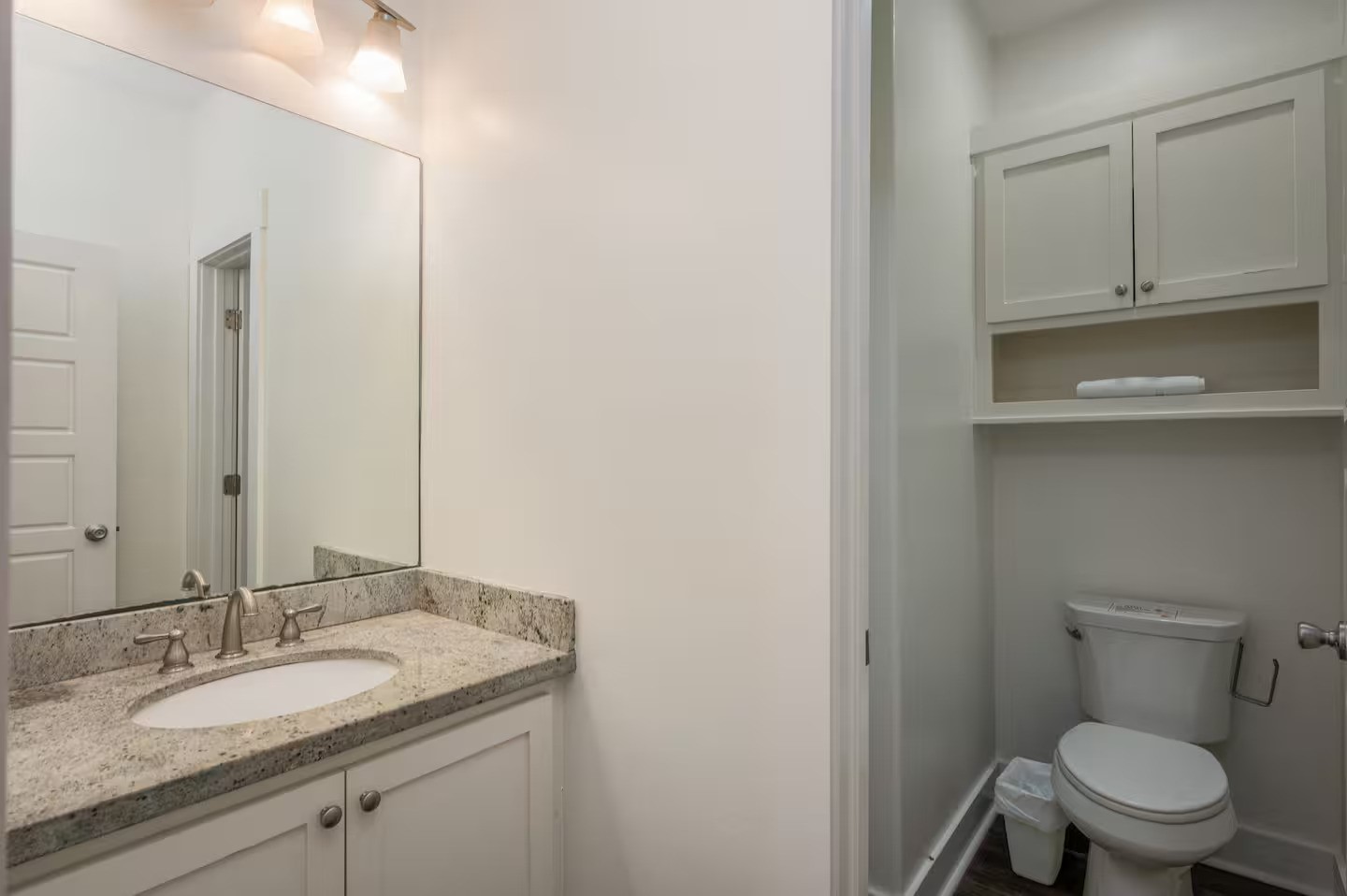 845 O' Neil Road Port Bolivar, TX 77650 - Photo 16 of 27 a bathroom with a granite countertop toilet sink and mirror