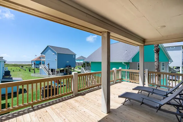 a view of a two chairs in the balcony