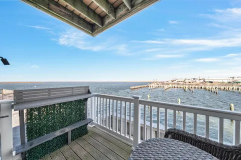 a view of a roof deck with couches