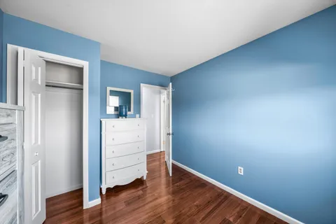 a bedroom with a bed and a desk
