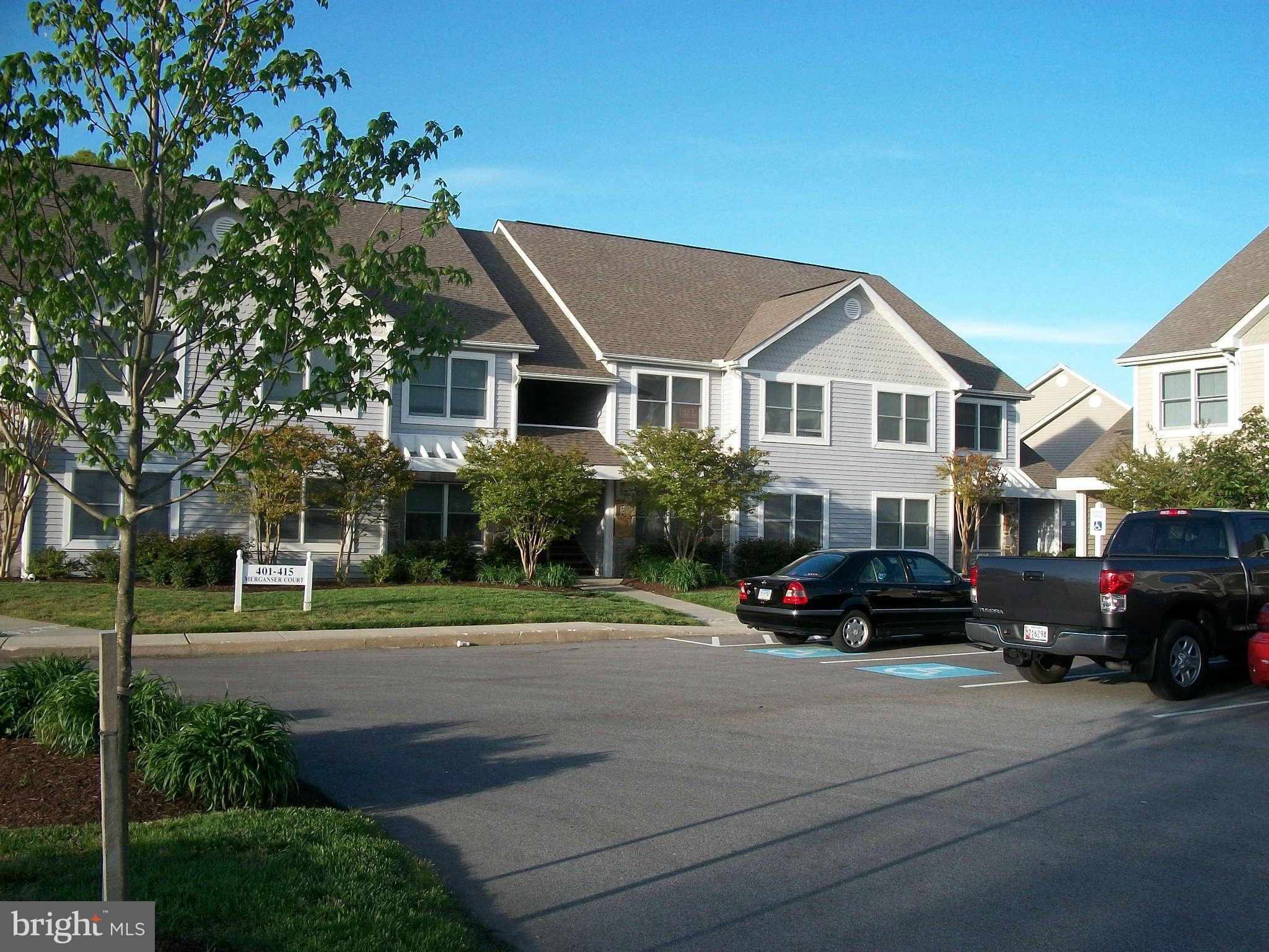 413 Merganser Court, Unit G Chester, MD 21619 - Photo 1 of 12 a car parked in front of a house