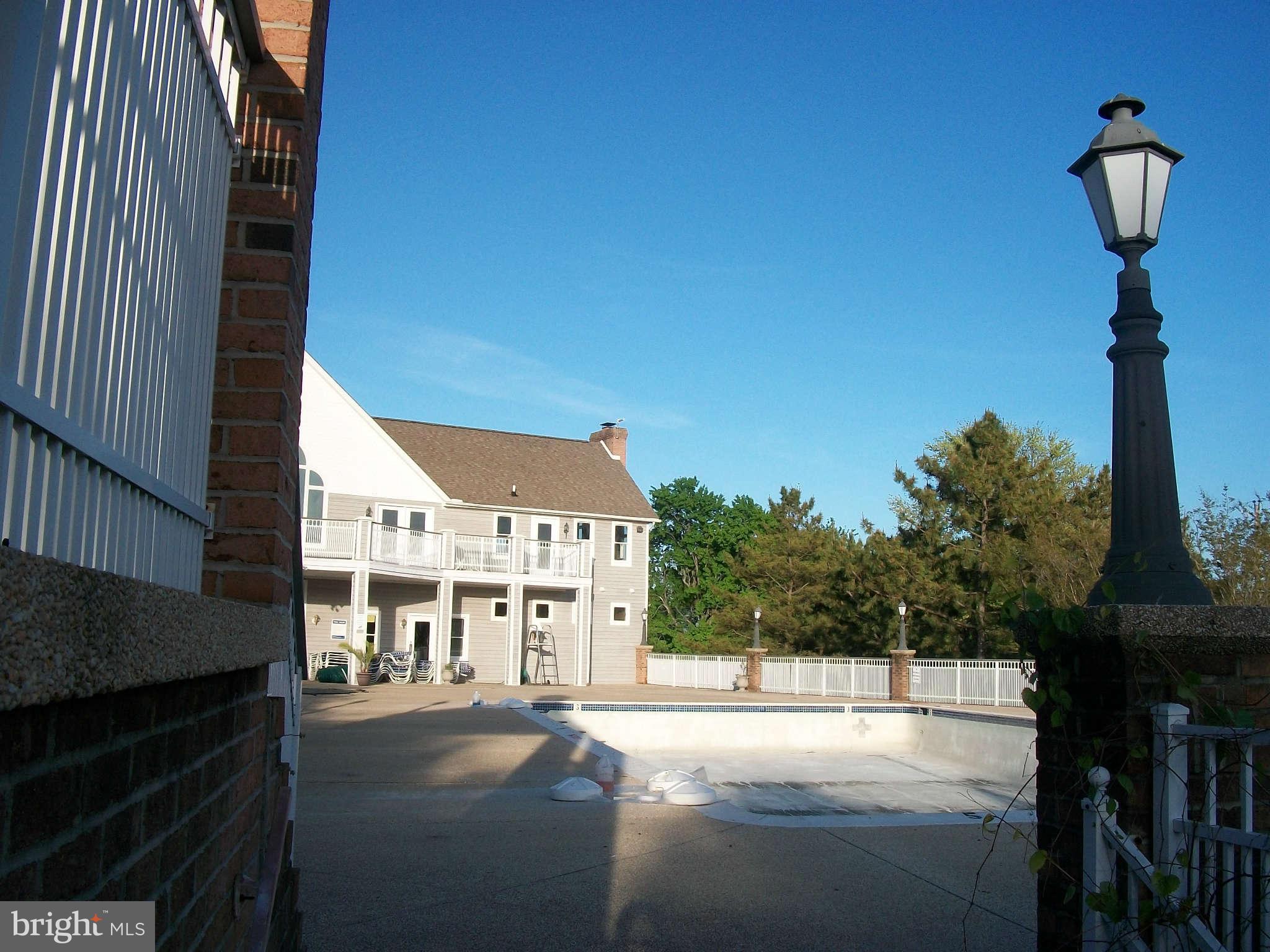 413 Merganser Court, Unit G Chester, MD 21619 - Photo 5 of 12 a view of a street with seating space
