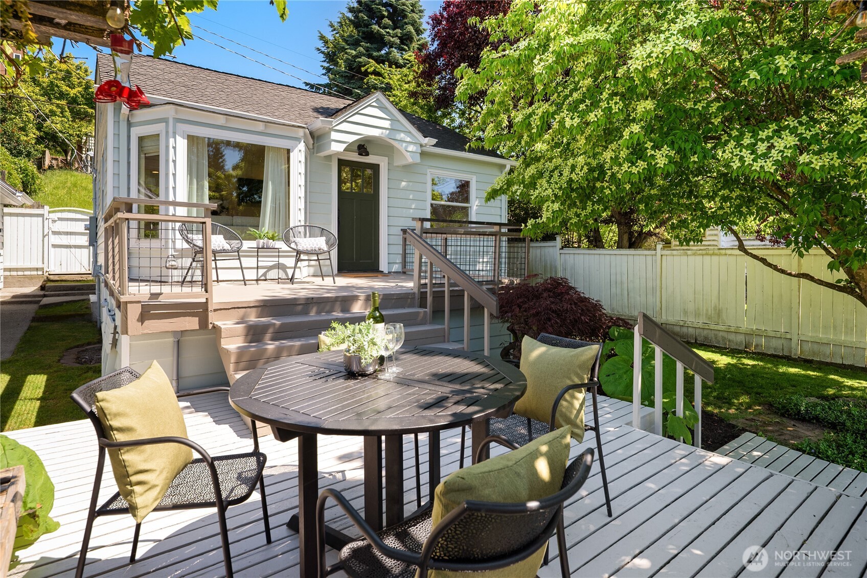 5648 38th Avenue Southwest Seattle, WA 98126 - Photo 1 of 40 a view of a house with backyard and sitting area