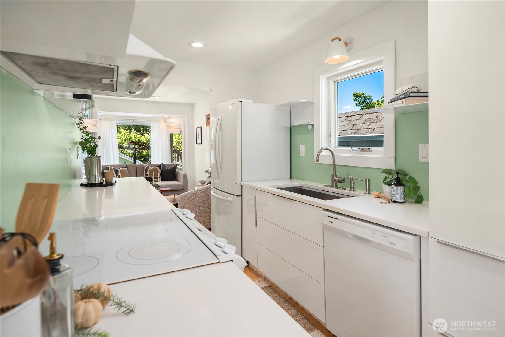 5648 38th Avenue Southwest Seattle, WA 98126 - Photo 11 of 40 a large white kitchen with a large window
