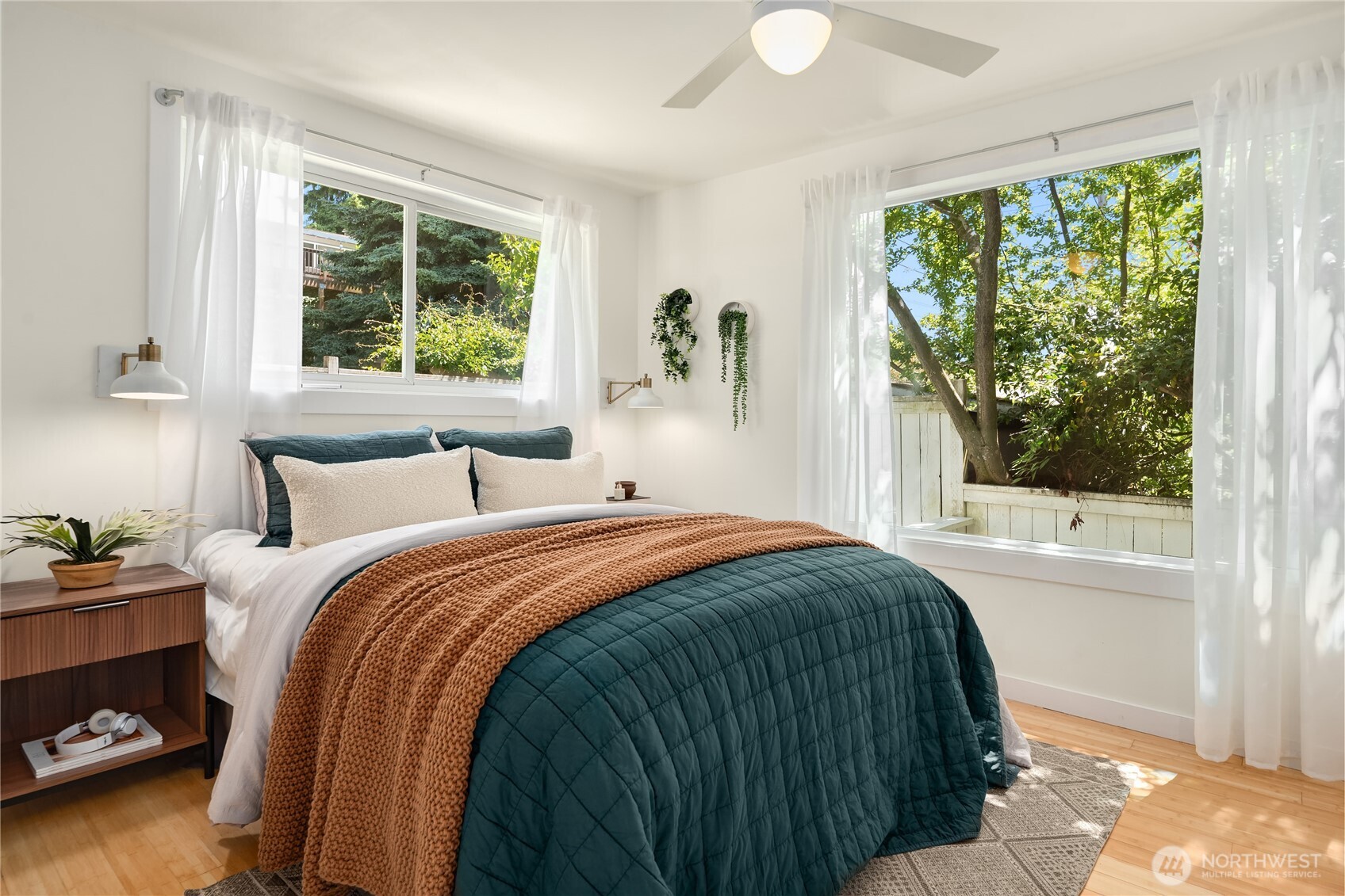 5648 38th Avenue Southwest Seattle, WA 98126 - Photo 14 of 40 a bedroom with a bed and a window