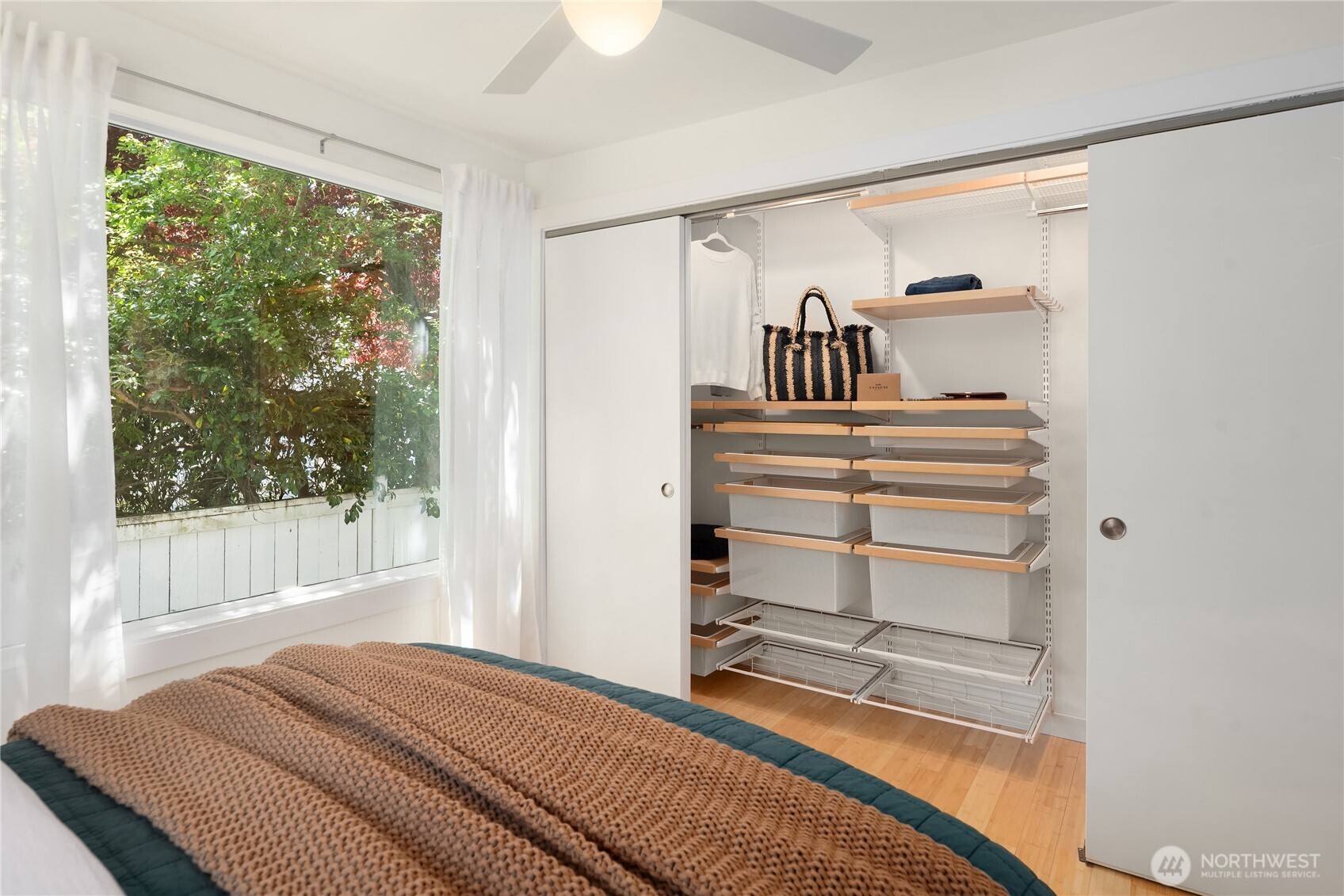 5648 38th Avenue Southwest Seattle, WA 98126 - Photo 15 of 40 a bedroom with a bed and a window