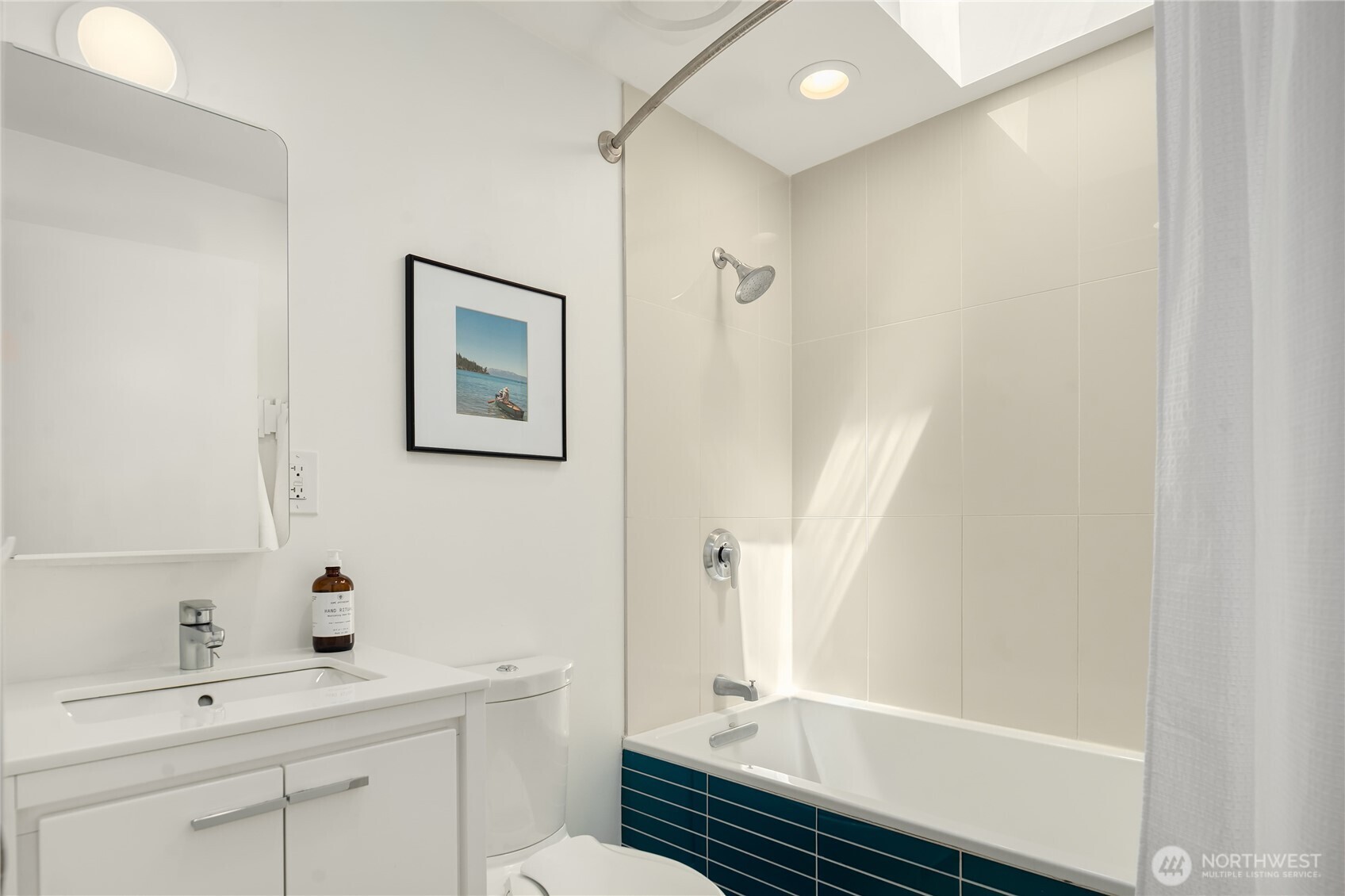 5648 38th Avenue Southwest Seattle, WA 98126 - Photo 16 of 40 a bathroom with a sink a toilet and shower