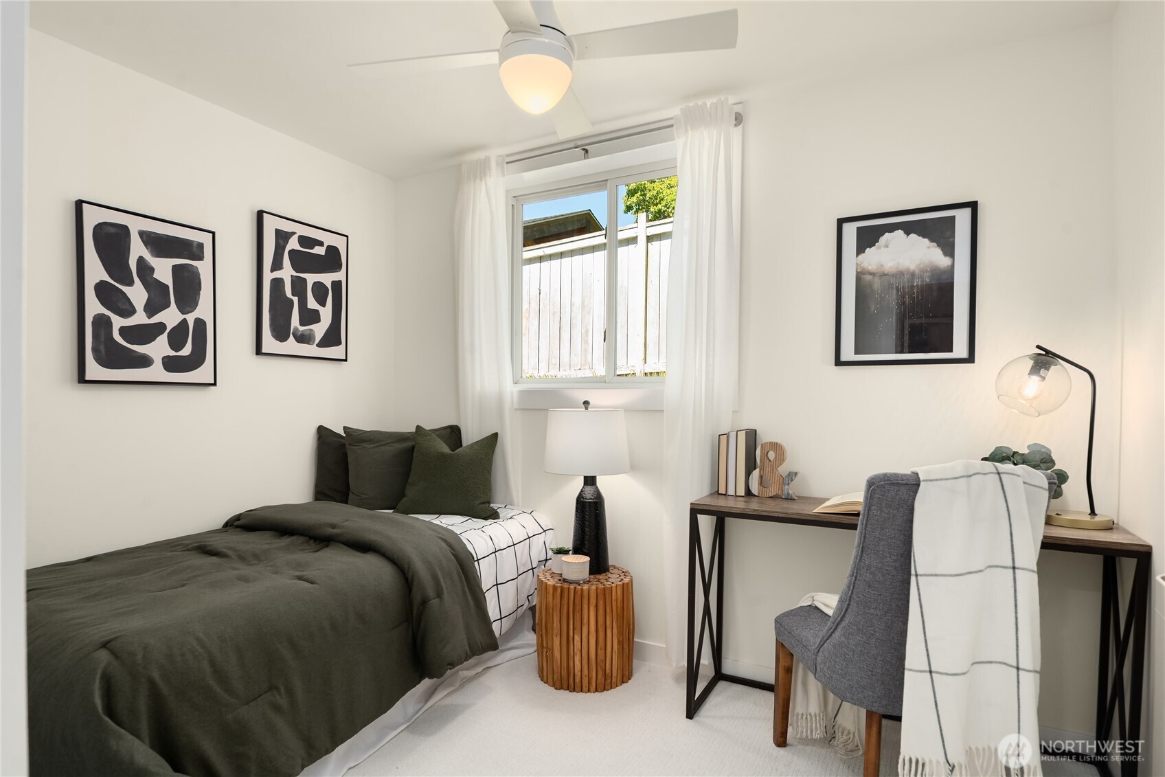5648 38th Avenue Southwest Seattle, WA 98126 - Photo 20 of 40 a bedroom with furniture and a window