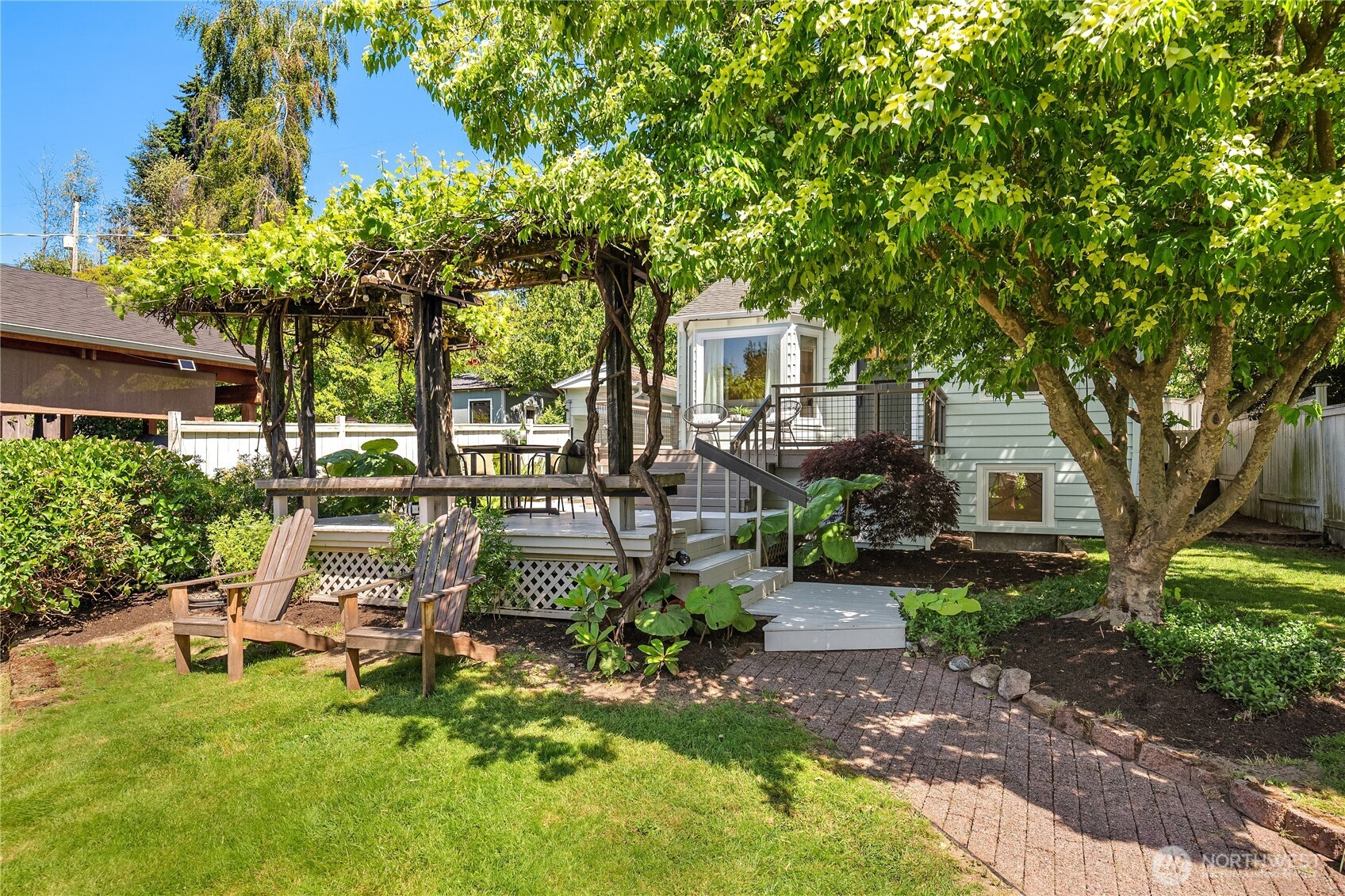 5648 38th Avenue Southwest Seattle, WA 98126 - Photo 23 of 40 a front view of a house with garden