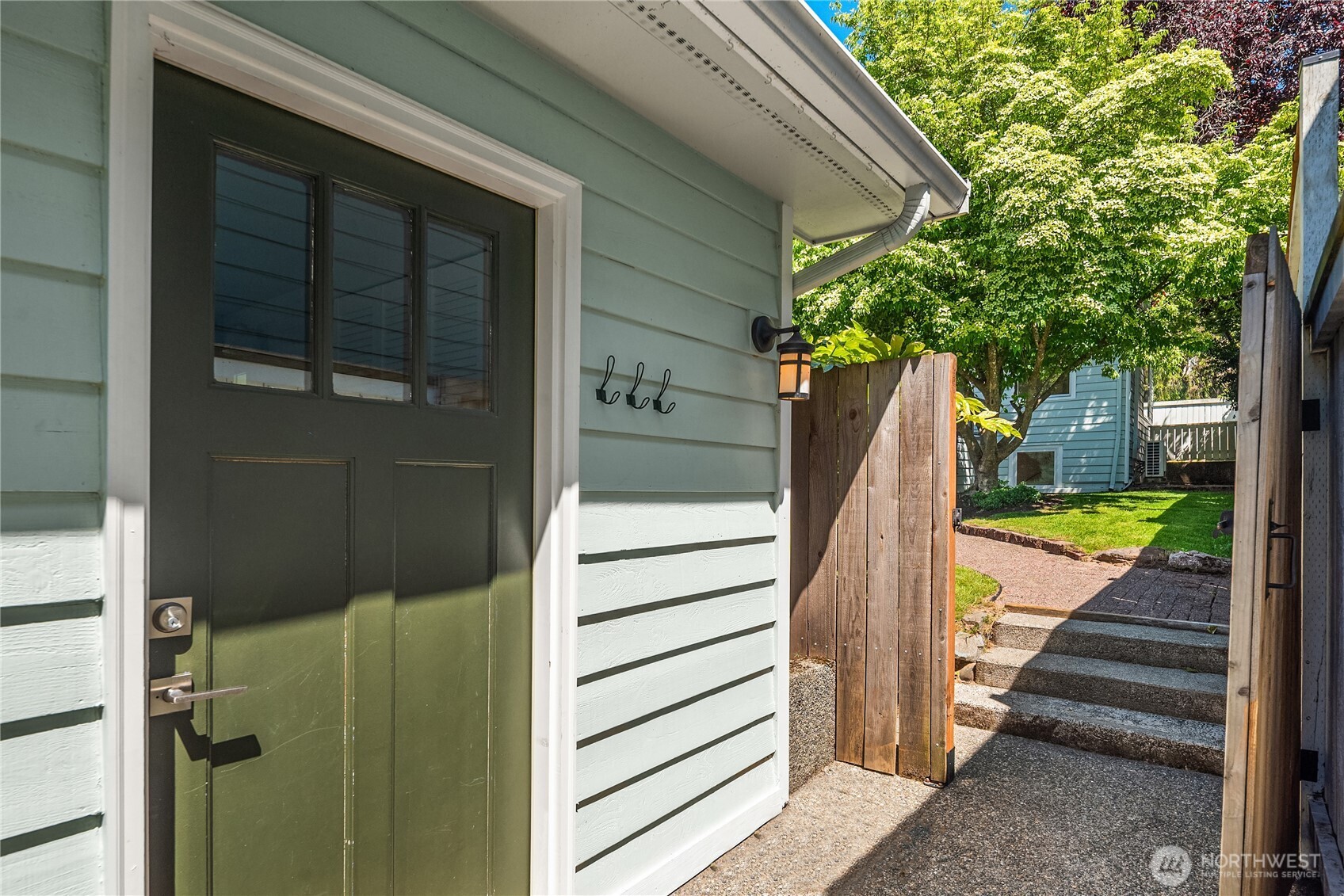 5648 38th Avenue Southwest Seattle, WA 98126 - Photo 24 of 40 a view of a wooden door and a window