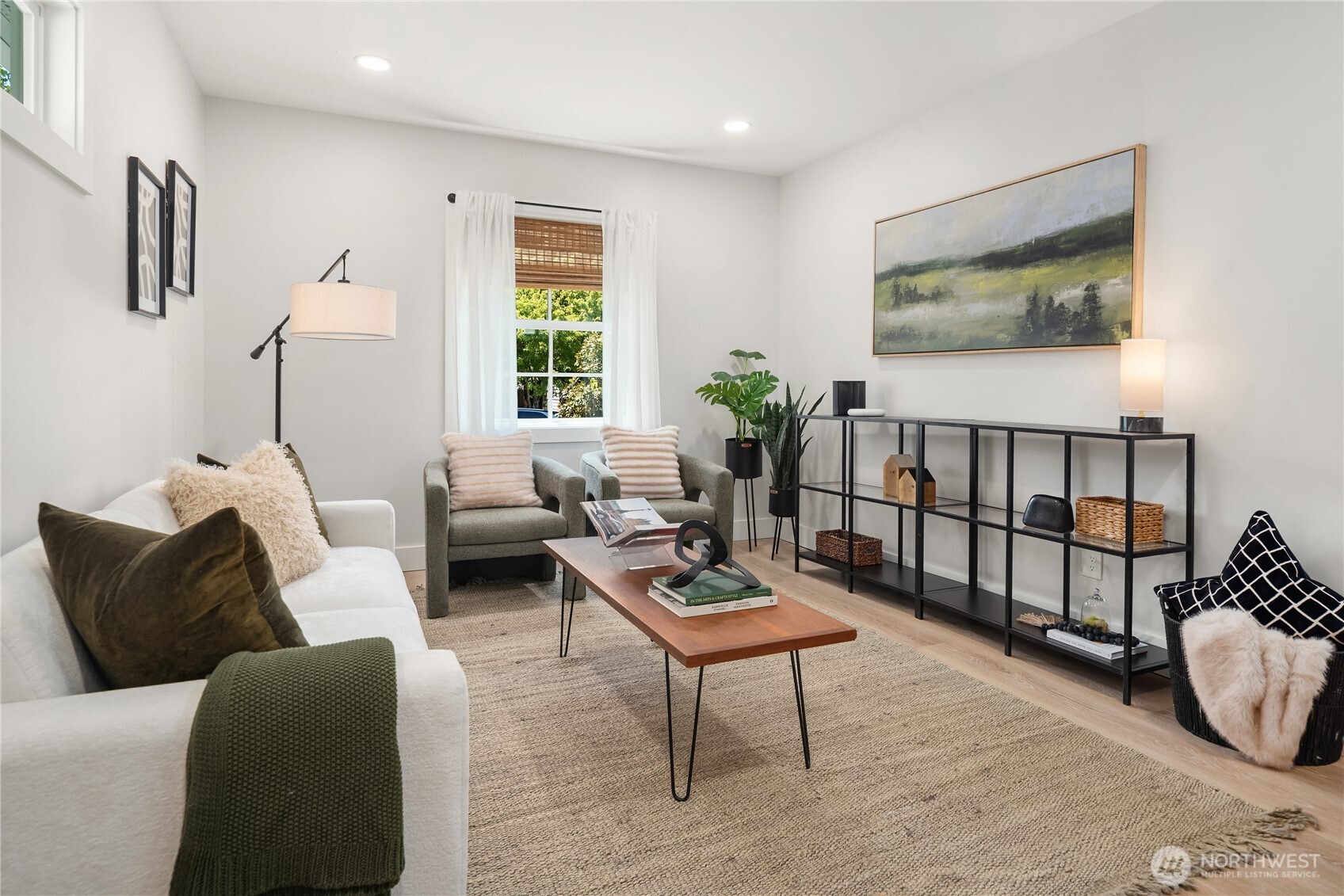 5648 38th Avenue Southwest Seattle, WA 98126 - Photo 26 of 40 a living room with furniture a rug and a window