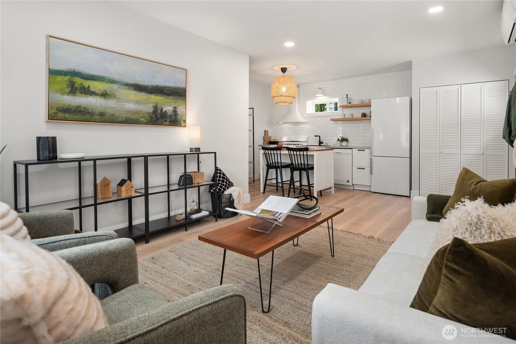 5648 38th Avenue Southwest Seattle, WA 98126 - Photo 28 of 40 a living room with furniture and a painting on the wall